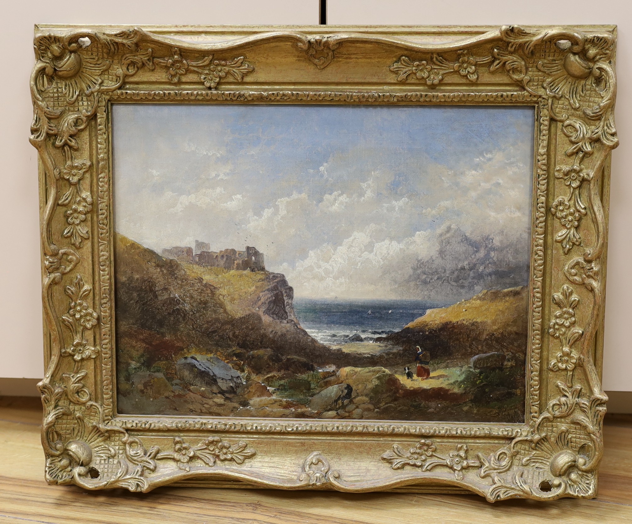 19th century English School, oil on canvas, Coastal landscape with woman, dog and castle ruins, 29 x 38cm